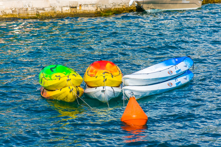 MONTENEGRO, PERAST - JUNE 04/2017: tourists parked their boats near the coast of the Boka Kotorska Bay.のeditorial素材