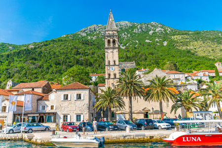 MONTENEGRO - JUNE 04/2017. Tourists sailed on the yacht past the city of Perast in the Boka Bay of Kotor.のeditorial素材