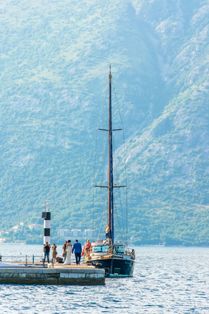 MONTENEGRO - JUNE 04/2017: Travelers held a wedding ceremony on the shore of the Boko-kotskoy bay on the background of a luxury yacht.のeditorial素材