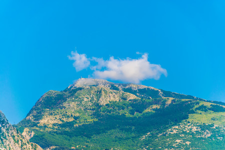 The television and radio tower with antenna is located on the peak of one of the high mountains in the Lovcen reserve.の写真素材