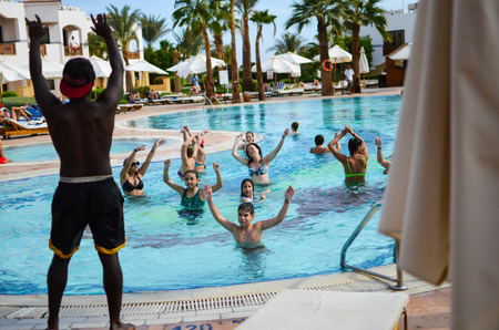 EGYPT, SHARM EL SHEIKH - 30 NOVEMBER / 2013. Visit hotels and evaluating the level of service. One of the fascinating attractions for tourists is the water aerobics.のeditorial素材
