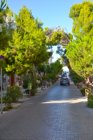 GREECE, CRETE, AGIOS NIKOLAOS - JULY 12/2014: Tourists walk through the picturesque streets of Agios Nicolasのeditorial素材