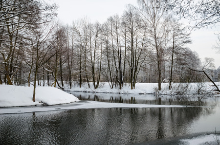 The picturesque river in the winter forestの写真素材