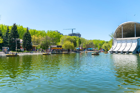 UKRAINE, DNEPROPETROVSK - APRIL 29/2017: the people of the city came to the park Chkalov for recreation near the summer theater.のeditorial素材