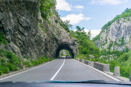A picturesque journey along the roads of Montenegro among rocks and tunnels. The river Moraca.の写真素材