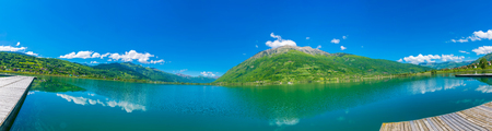 A picturesque mountain lake is located in a valley among the mountains.の写真素材