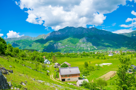 In a picturesque valley among the mountains there is a small village.の写真素材