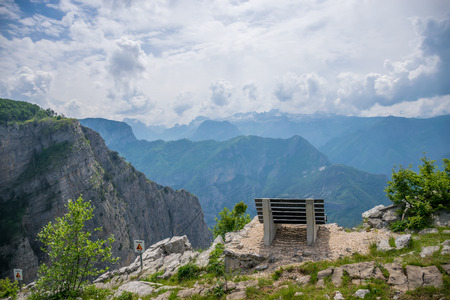 A picturesque bench for meditation is on top of a cliff.の写真素材