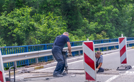 MONTENEGRO - MAY 28/2017: Workers restore the road near the monastery of Moraca.のeditorial素材