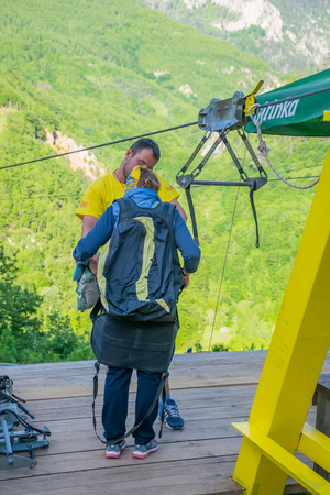 MONTENEGRO - MAY 29/2017: tourists ride on the Zipline through the canyon of the Tara River.のeditorial素材