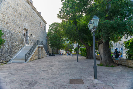 MONTENEGRO, BUDVA - MAY 30/2017: tourists stroll through the streets of the old city.のeditorial素材