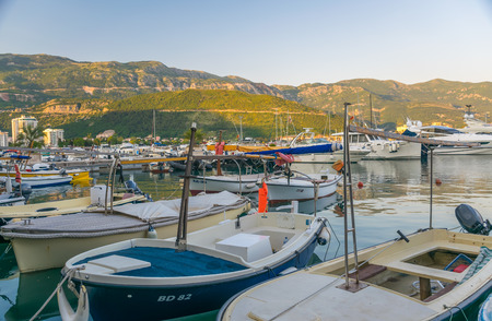 MONTENEGRO, BUDVA - MAY 30/2017: fishermen and yachtsmen moored their vessels in a dock for overnight.のeditorial素材