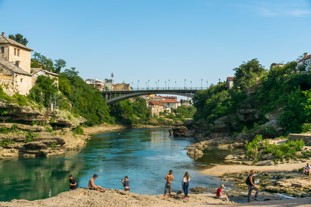 BOSNIA AND HERZEGOVINA, MOSTAR - JUNE 1/2017: tourists visited the bridge built in the Ottoman style.のeditorial素材