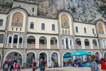 MONTENEGRO, OSTROG MONASTERY - JUNE 03/2017: The pilgrims came to a medieval monastery for the celebration of the Holy Trinity.のeditorial素材