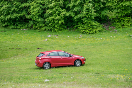 MONTENEGRO - JUNE 03/2017: the car is parked by tourists on the roadside of serpentine for sightseeing.のeditorial素材