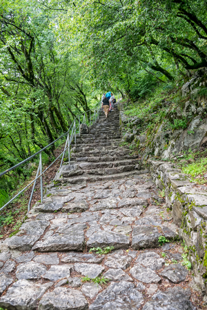 MONTENEGRO, OSTROG MONASTERY - JUNE 03/2017: The pilgrims came to a medieval monastery for the celebration of the Holy Trinity.のeditorial素材