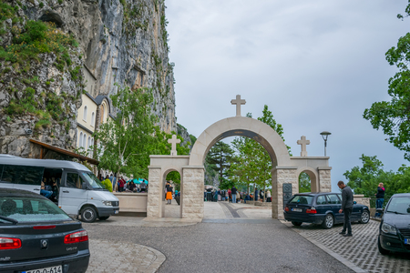 MONTENEGRO, OSTROG MONASTERY - JUNE 03/2017: The pilgrims came to a medieval monastery for the celebration of the Holy Trinity.のeditorial素材
