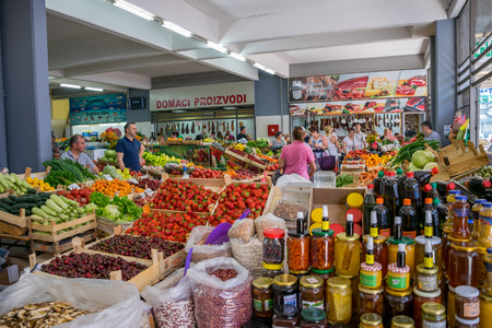 MONTENEGRO, BUDVA - JUNE 05/2017: tourists make their purchases in the central city market.のeditorial素材