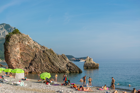 MONTENEGRO, RAFAILOVICI - JUNE 05/2017: tourists swim in the Adriatic Sea during sunset.のeditorial素材