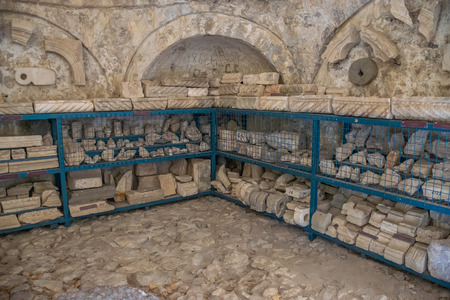 Stone fragments of architecture are presented for free inspection.