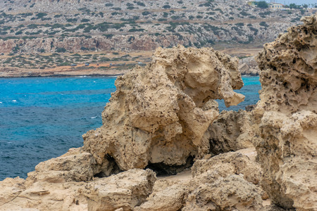 A large boulder broke off from the coastal cliff.の写真素材