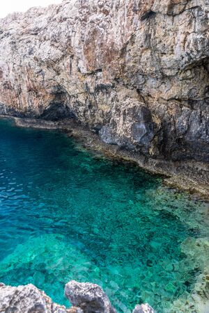The rocky coast of the Mediterranean Sea on the island of Cyprus.の写真素材