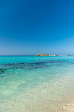 The most famous beach of Cyprus with crystal clear water. Nissi Beach.の写真素材