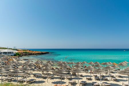 Tourists relax on the famous beach of Cyprus. Nissi Beachの写真素材
