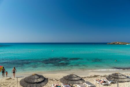 Tourists relax on the famous beach of Cyprus. Nissi Beachの写真素材