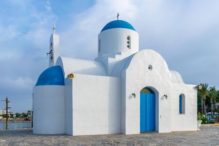 The picturesque Orthodox temple, built in the Greek style, is located on the coast of Cyprus.の写真素材
