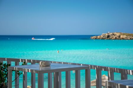 Picturesque terrace on the coast of the azure sea.の写真素材