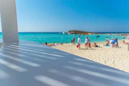 CYPRUS, NISSI BEACH - MAY 12/2018: Tourists relax and swim on one of the most popular beaches on the island.のeditorial素材