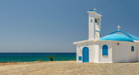 On the seashore is the chapel and cave of Ayia Thekla.の写真素材