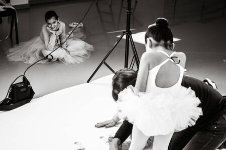 Ballet dancer with white tutu isolated wit h white background. Ballet classes at the classical dance...