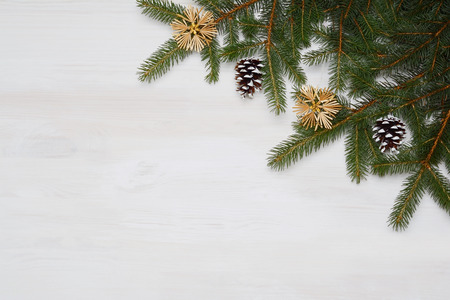 Christmas fir tree with decorations on wooden background.の写真素材