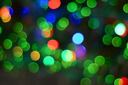 Defocused christmas lights background. Colorful lights background.の写真素材