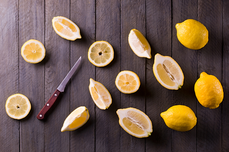 Fresh lemons on rustic wooden background.の写真素材