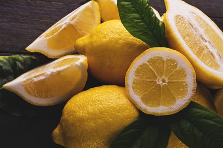 Fresh lemons on rustic wooden background.の写真素材