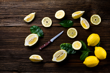 Fresh lemons on an old vintage wooden table.の写真素材