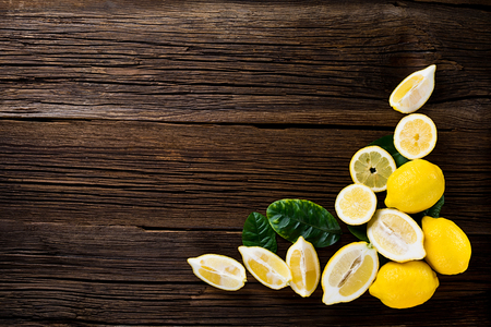 Fresh lemons on an old vintage wooden table.の写真素材