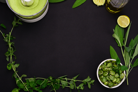 Bean paste and boiled broad beans on a black background.の写真素材