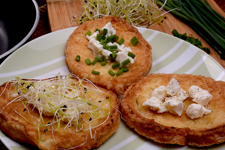 French toasts with goats cheese, fresh chives and sprouts.の写真素材