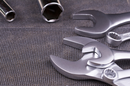 Set of  wrenches on a metal background.の写真素材