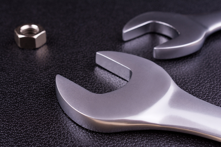 Spanners of various sizes, on dark abstract background.の写真素材