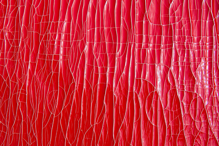 Red retro background. Cracks, paint, colorful texture.
