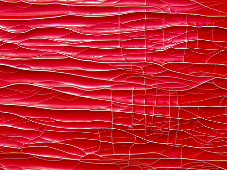 Red retro background. Cracks, paint, colorful texture.