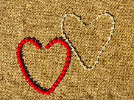 2 bead heart on a rusty metal backgroundの写真素材
