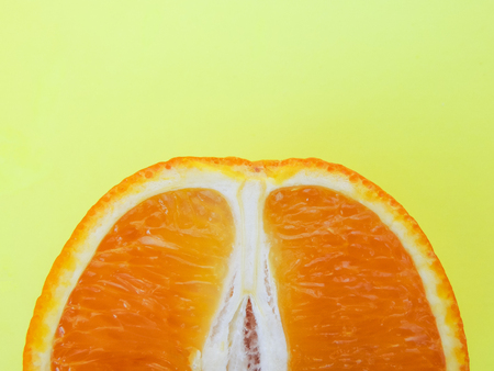 Juicy cut orange close-up on the table. Vitamin Cの写真素材