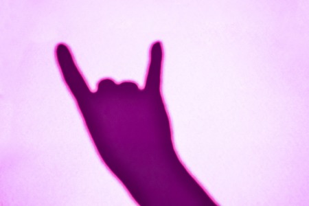 Hand makes the rock gesture goat fingers up.の写真素材