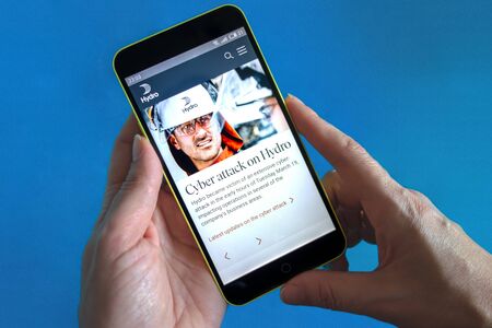 Berdyansk, Ukraine - March 23, 2019: Norsk Hydro website homepage. Norsk Hydro logo visible on the phone screen.のeditorial素材